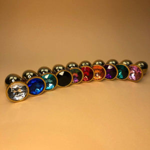 Маленькая золотая анальная пробка с круглым кристаллом