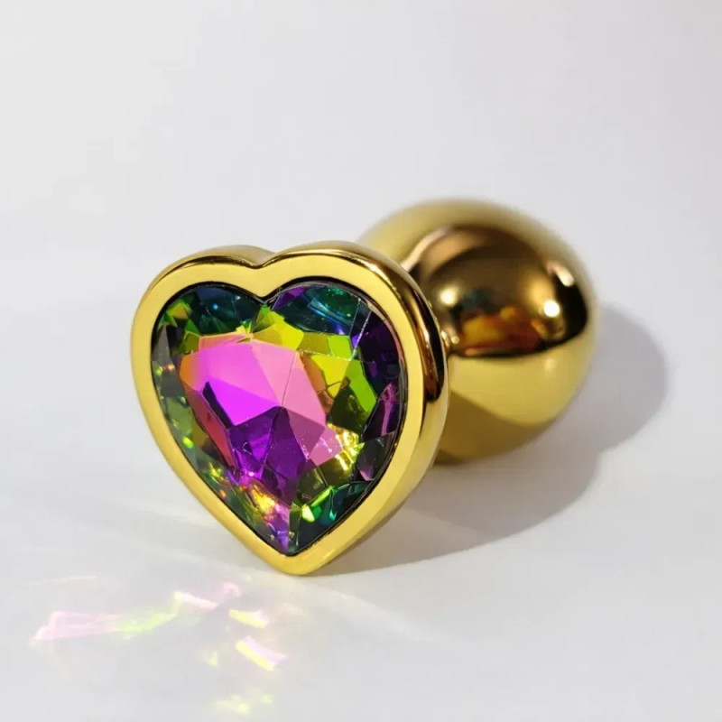 Анальная пробка ALUME, S, металлическая золотистая с разноцветным камнем в форме сердца. Анальная пробка ALUME, S, металлическая золотистая с разноцветным камнем в форме сердца.